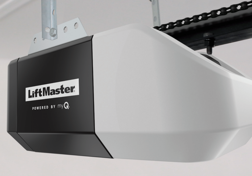 LiftMaster garage door opener with chain, mounted on ceiling. Black and white.