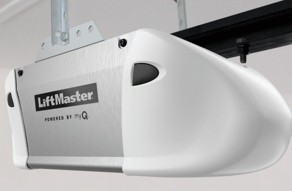 A LiftMaster garage door opener mounted on the ceiling. White and silver.