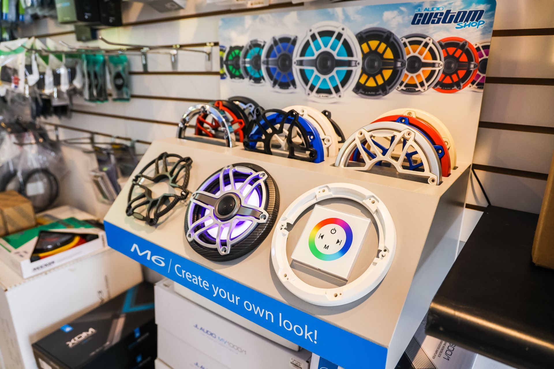 A display of different types of speakers in a store.