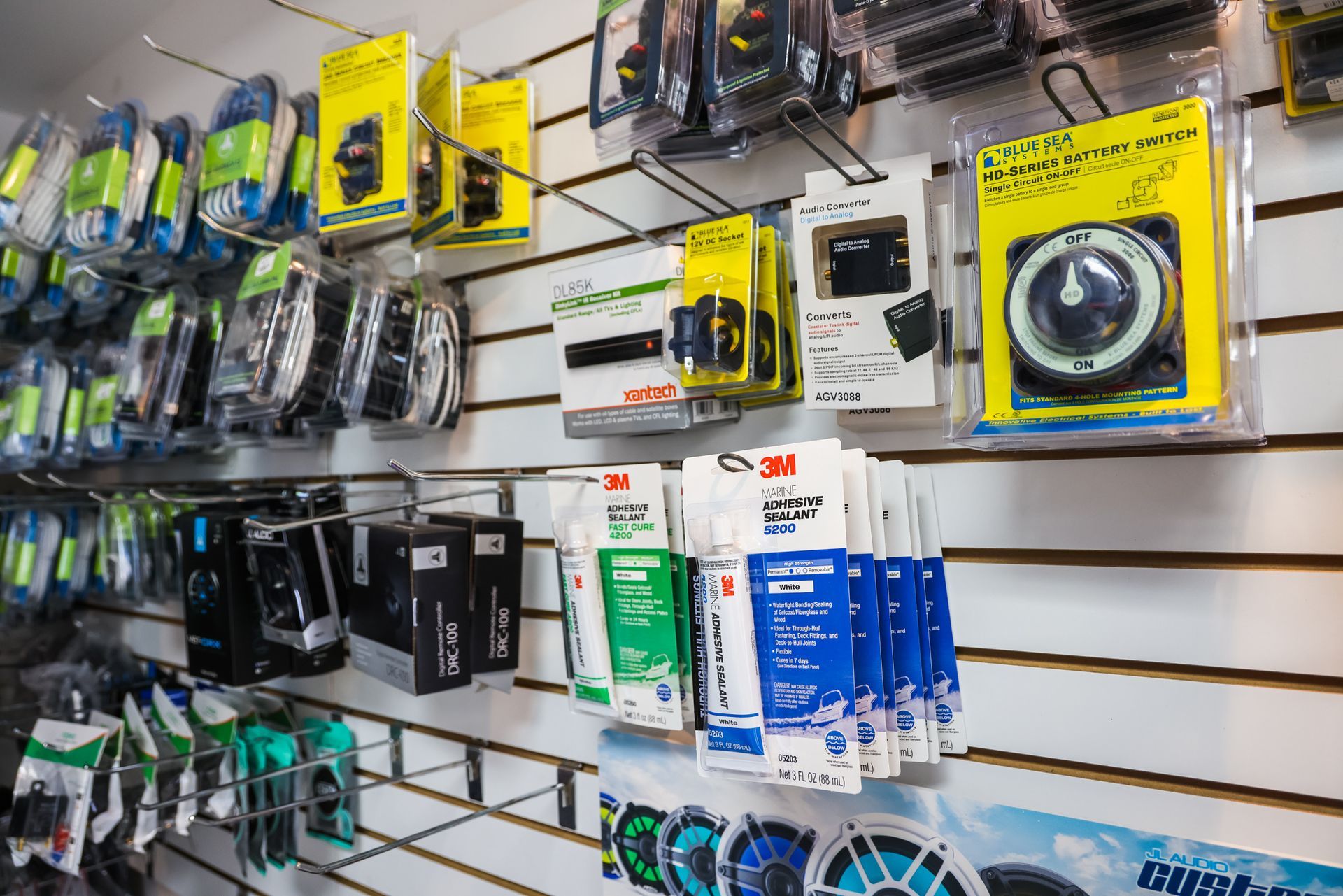 There are many different types of products hanging on the wall.