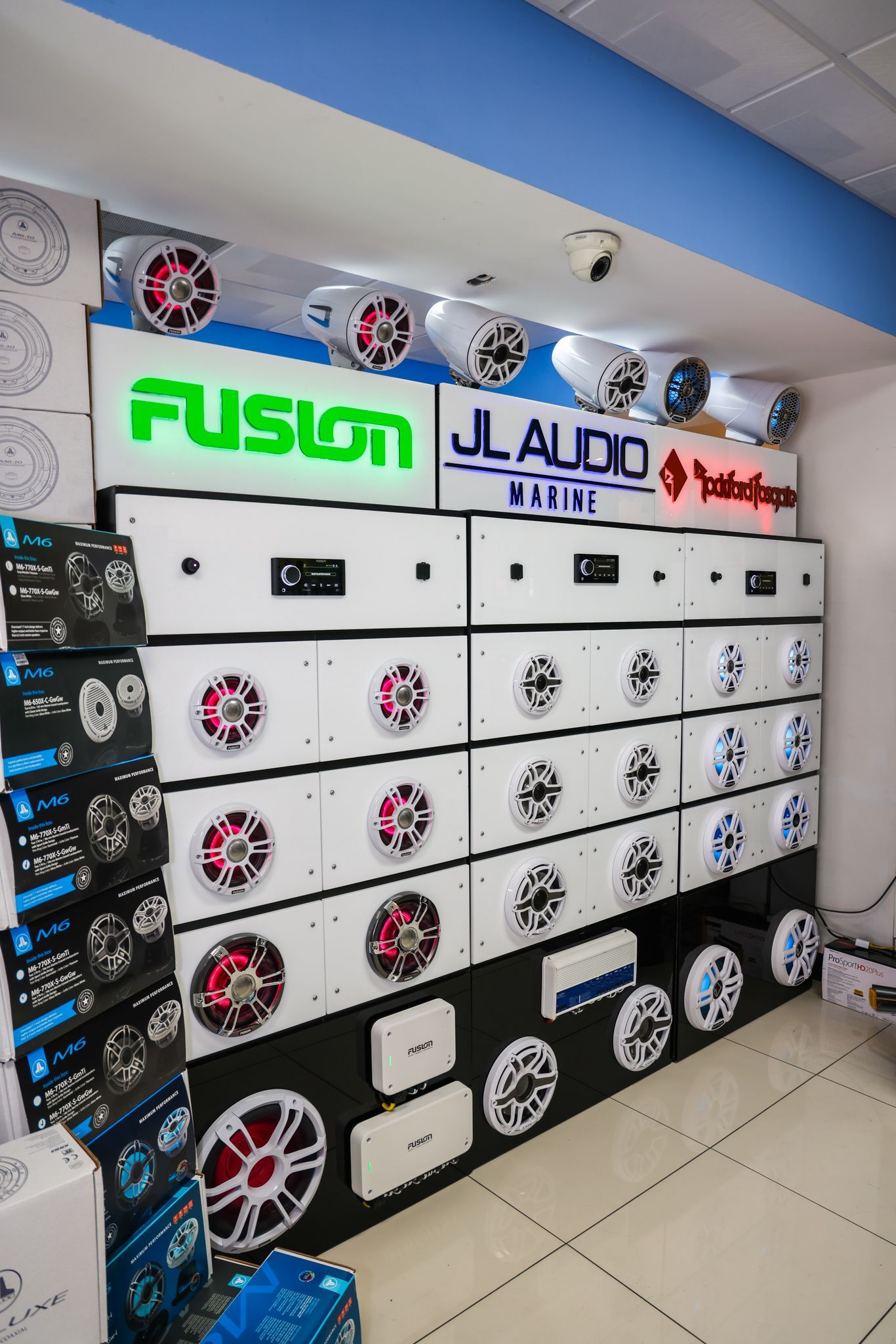 A room filled with lots of speakers and boxes.