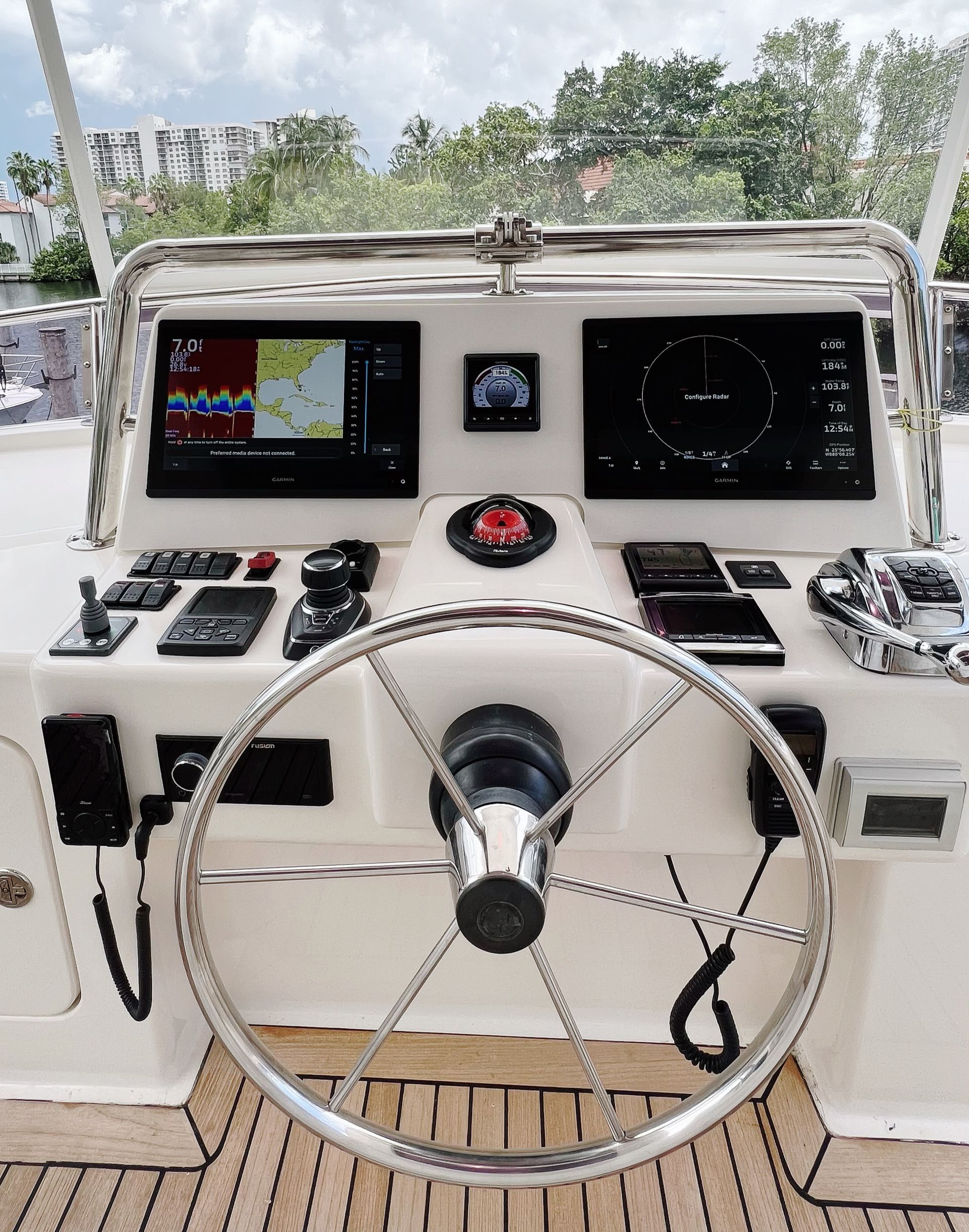 A close up of a steering wheel on a boat
