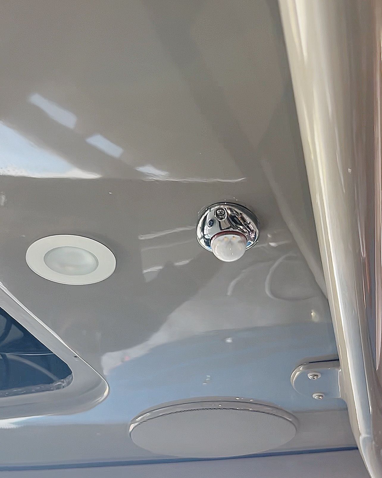 A close up of a ceiling with a light on it