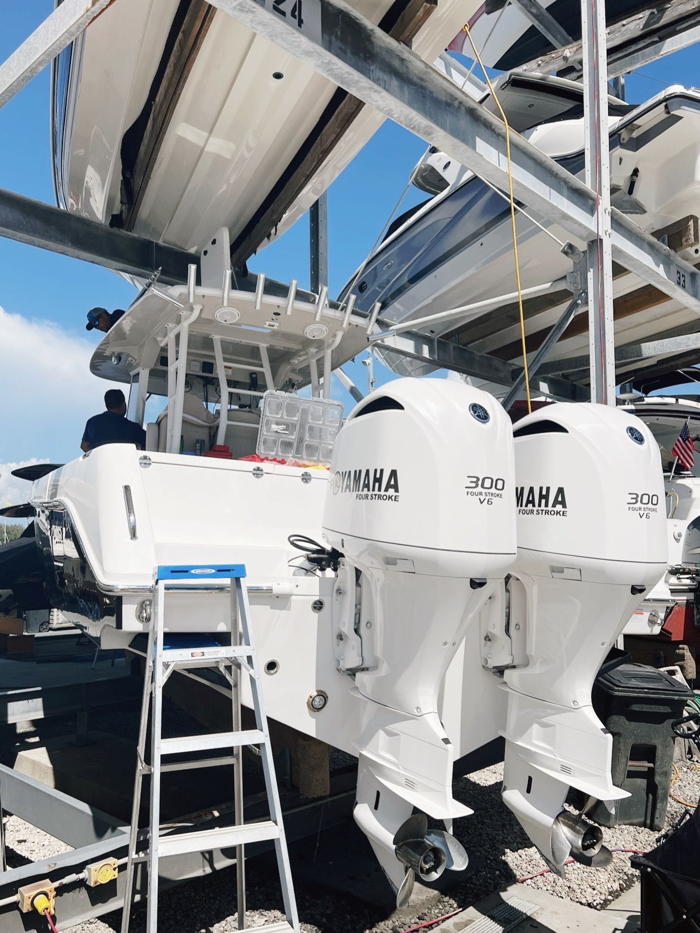 Two yamaha outboard motors are sitting on top of a boat.