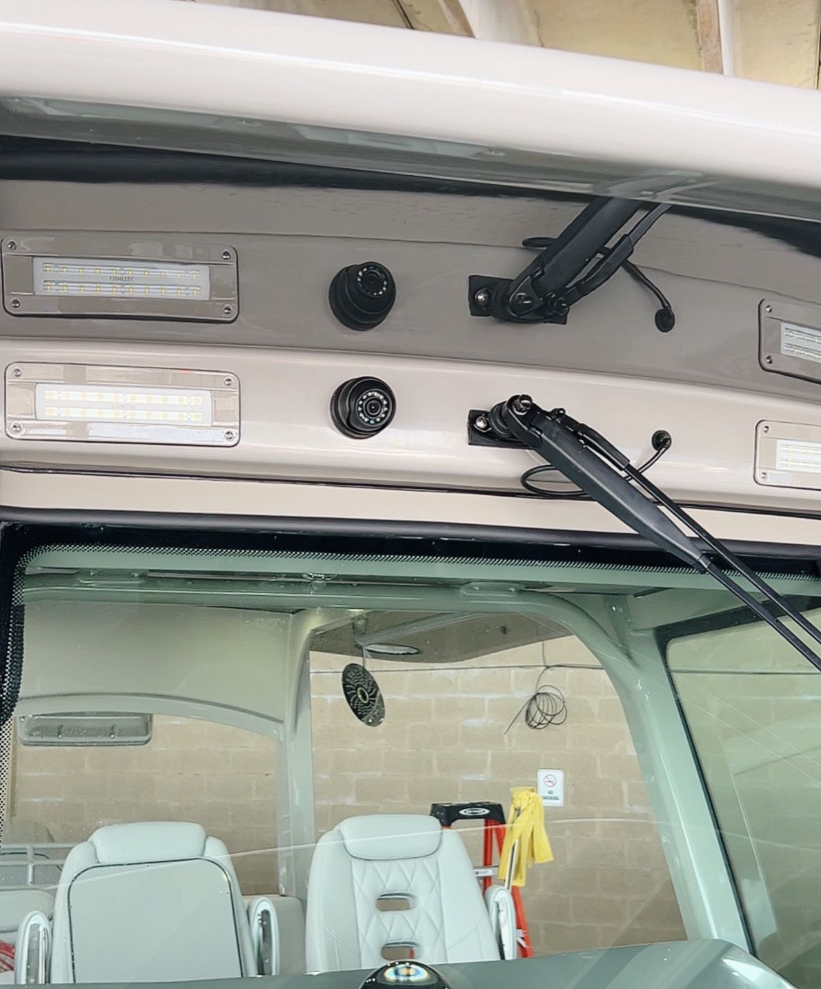 A car with a windshield that has a wiper on it