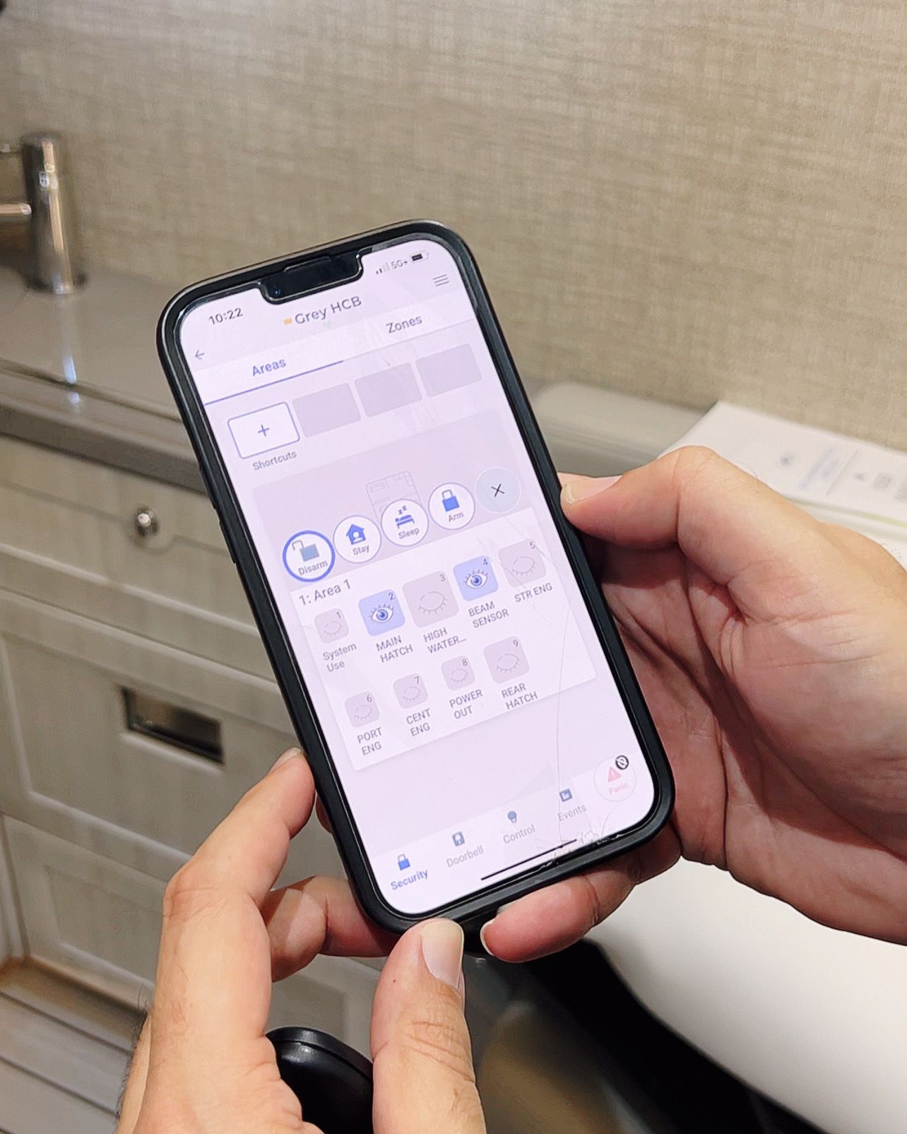 A person is holding a cell phone in their hand.