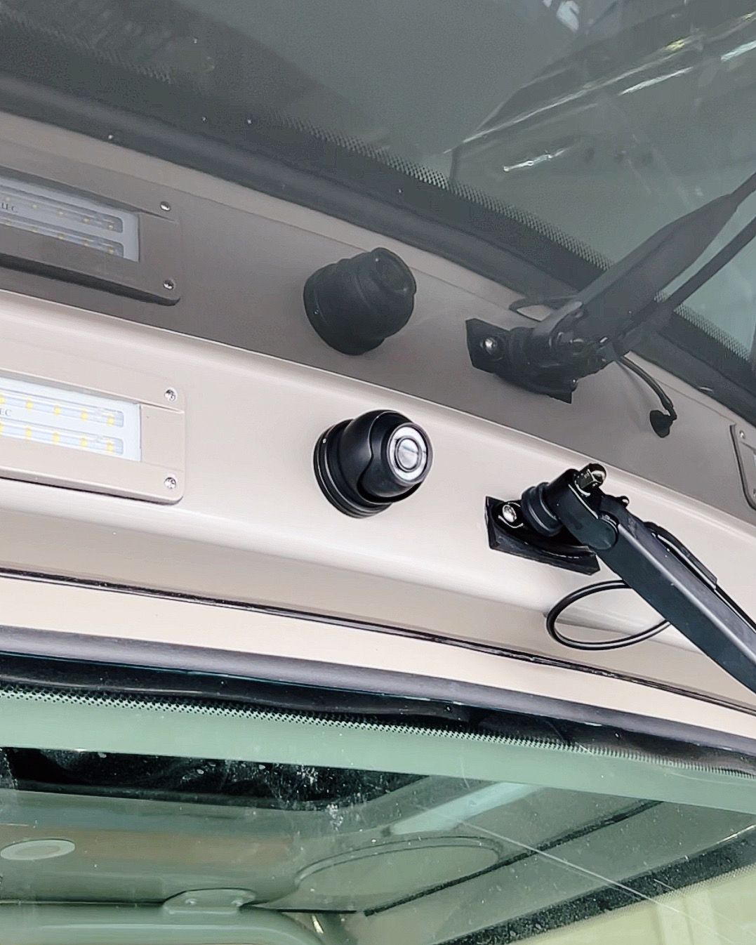 A close up of a windshield with a wiper on it