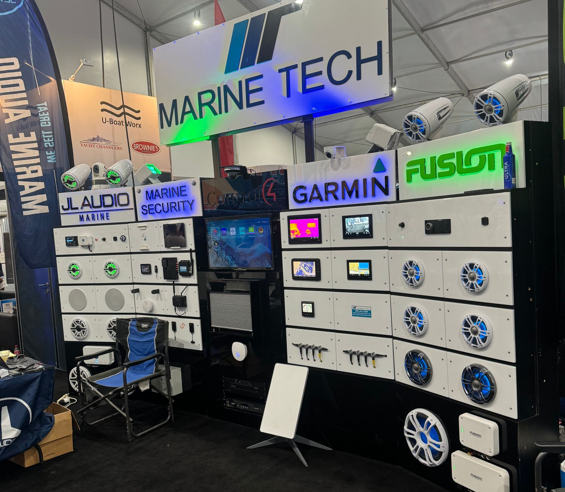 Marine Tech booth showcasing marine audio and navigation equipment at a trade show.