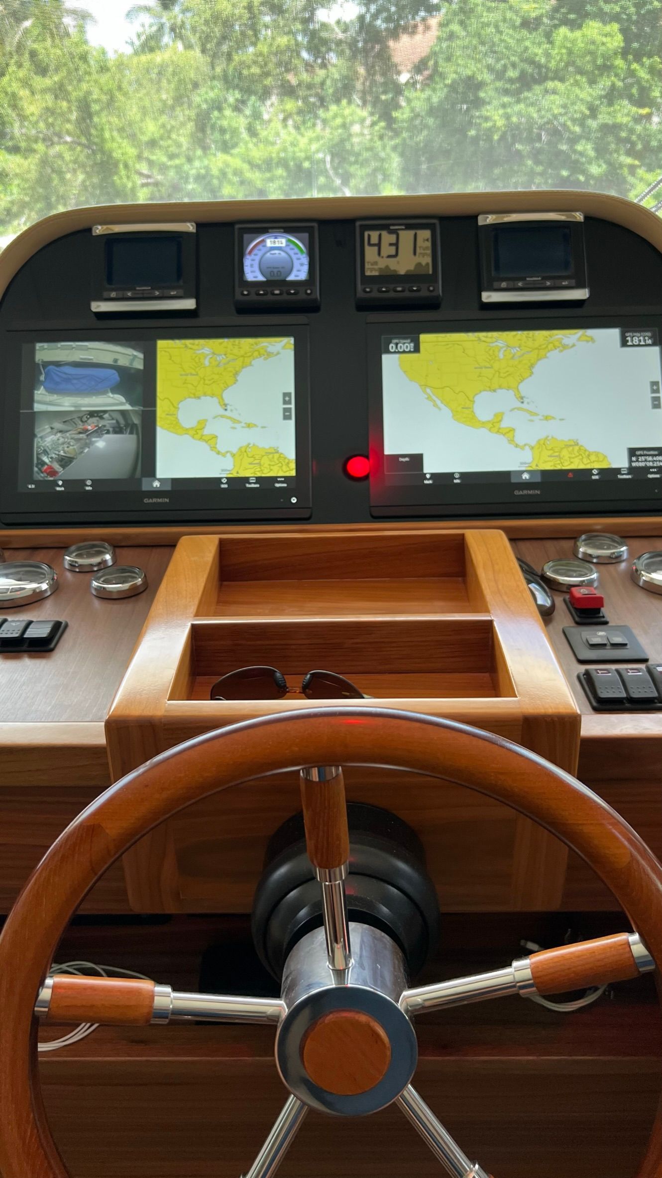 A close up of a steering wheel on a boat.