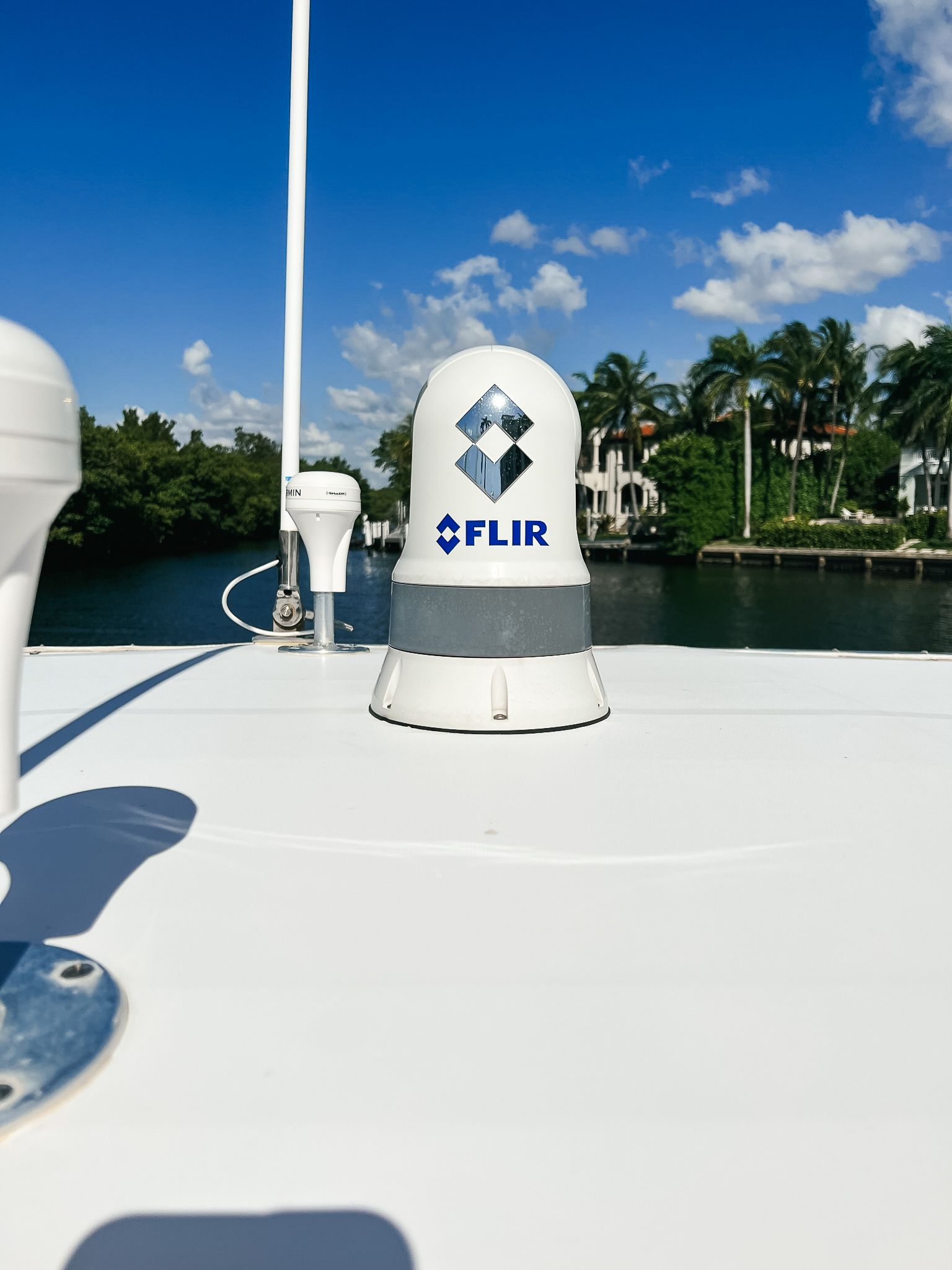 A flir device is on the roof of a boat