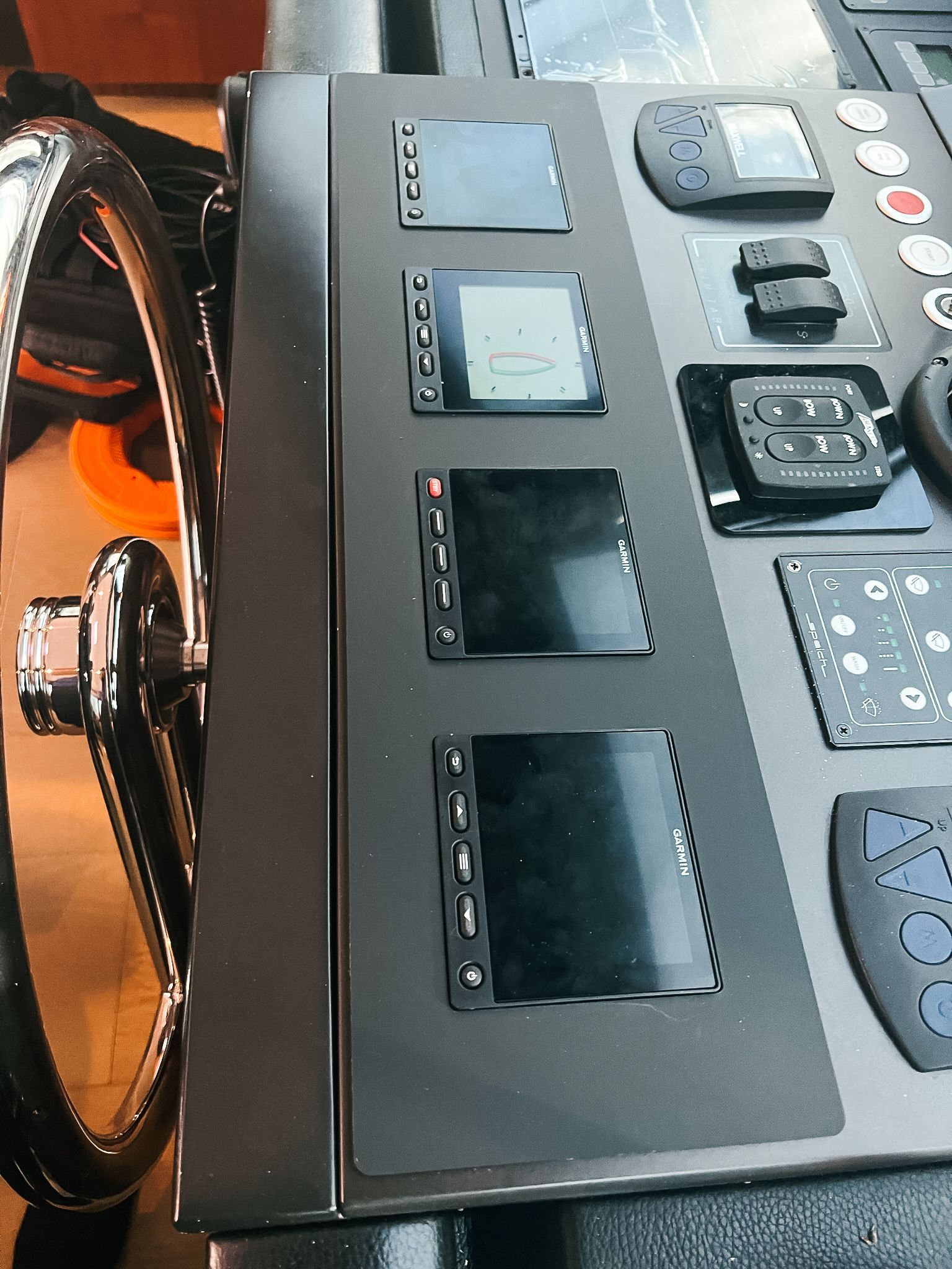 A close up of a device with a wheel in the background