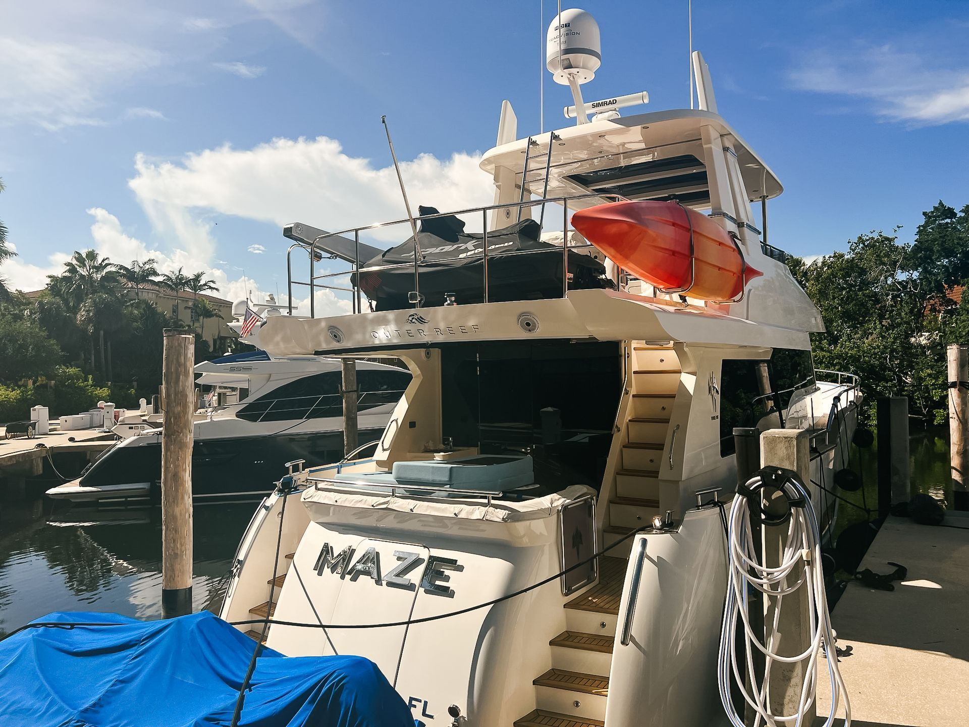 A boat with the name maze on the back of it