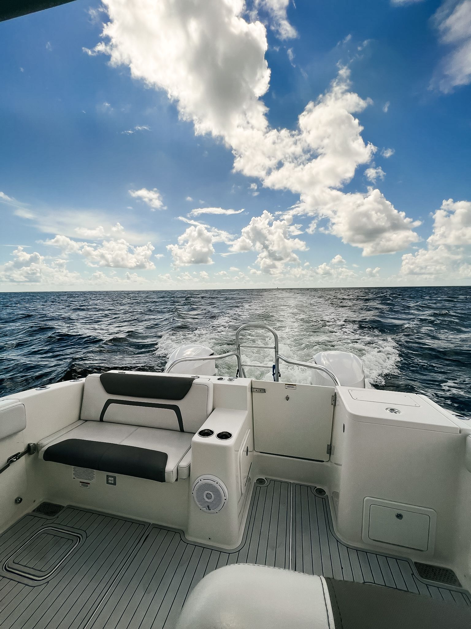 A boat is floating on top of a large body of water