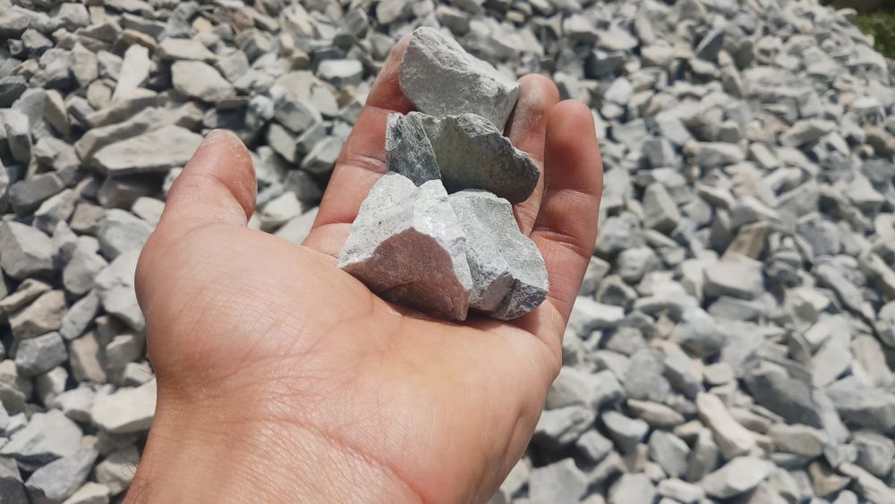 Person is Holding a Pile of Rocks in Their Hand  — Barry's Recycling in Redland Bay, QLD