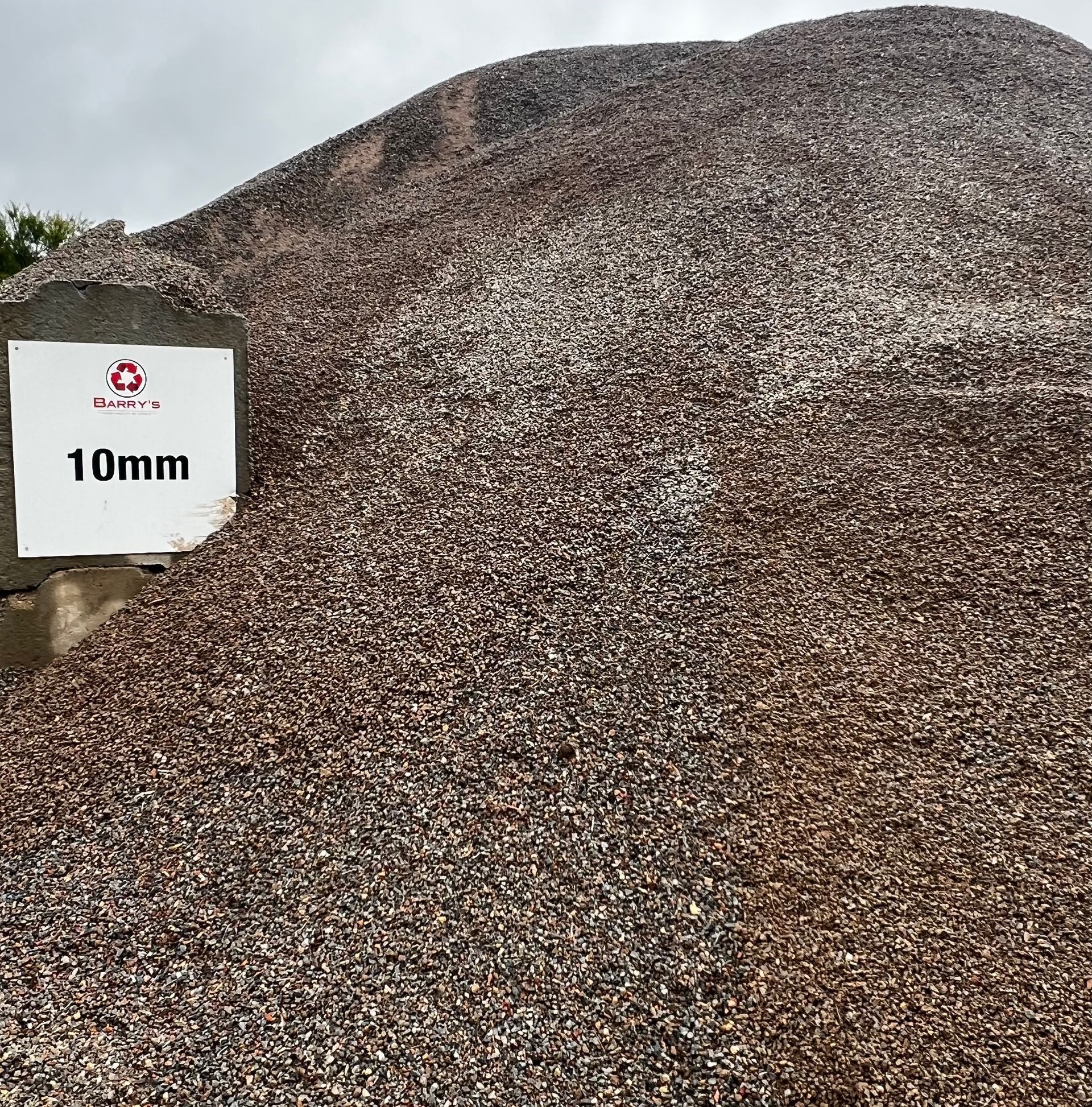 Large Pile of Gravel With a Sign That Says 10mm on It  — Barry's Recycling in Redland Bay, QLD