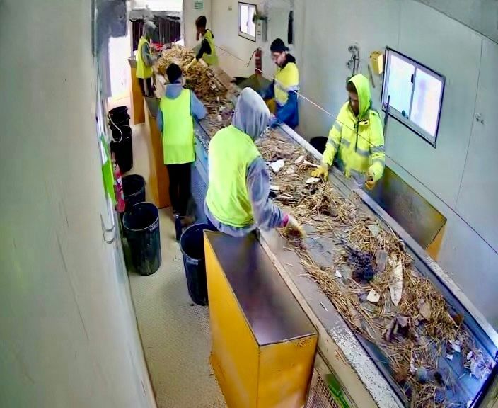 A Bulldozer Is Breaking Bricks on A Construction Site — Barry's Recycling in Redland Bay, QLD