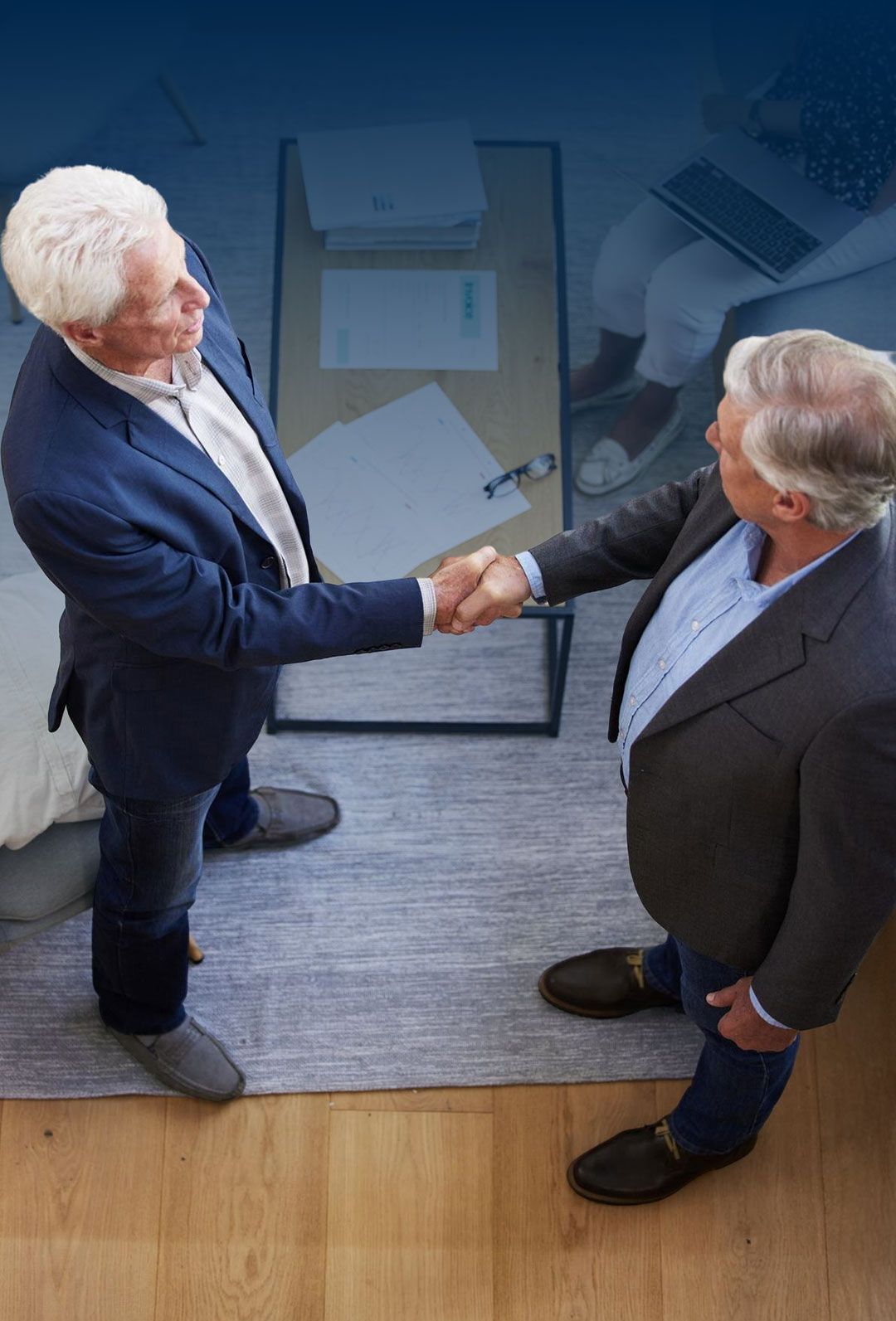 Medical professionals discussing patient care in clinic hallway