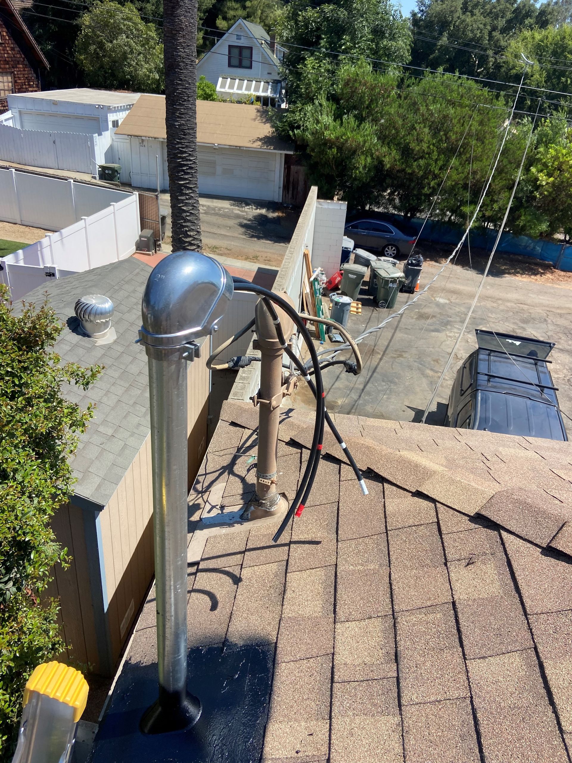 An aerial view of a roof with a chimney on it