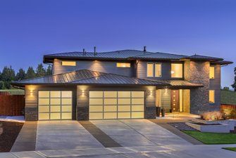 Roof Repairs Near Me — Beautiful Home Exterior at Night in Sparks, NV 