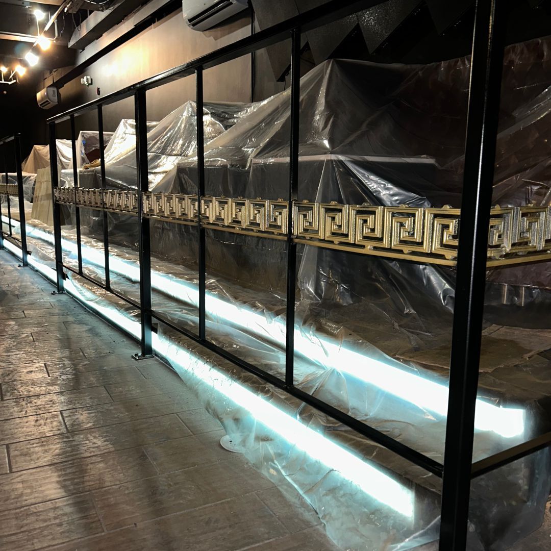 A greek key design is on the side of a building