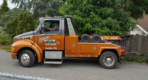Towing Services — Orange Tow Truck in Seattle, WA