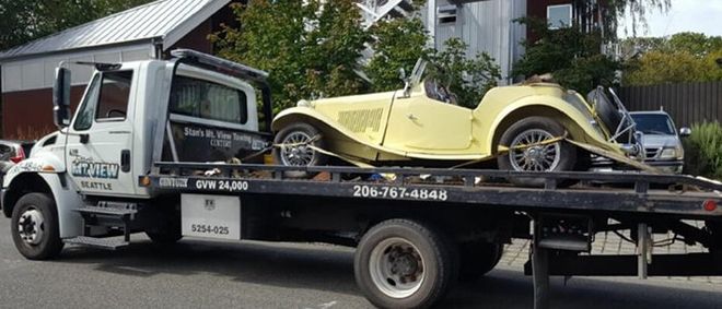 Heavy Duty Towing — Yellow Car on Tow Truck in Seattle, WA