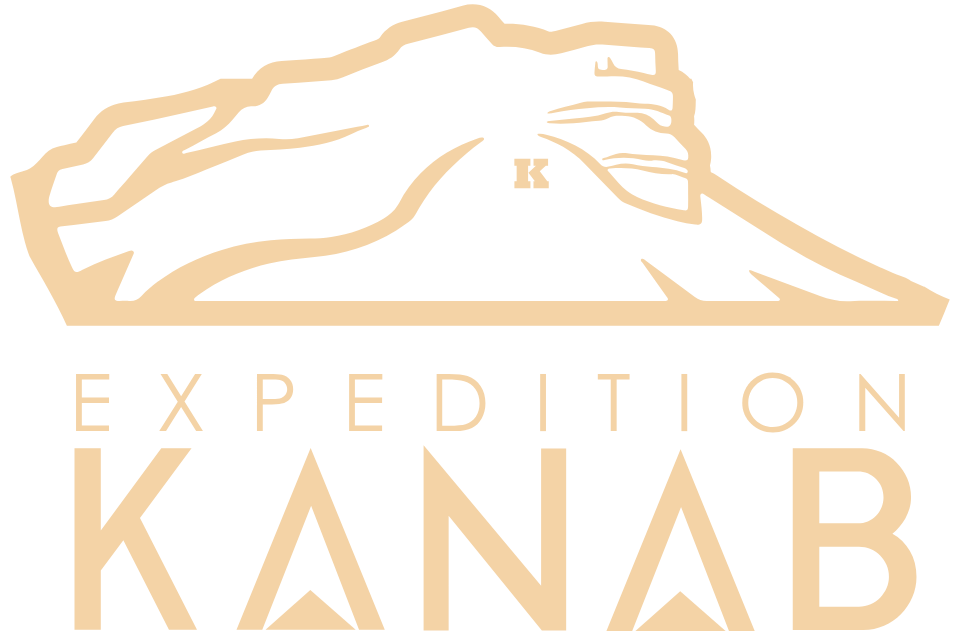 A logo for expedition kanab with a mountain in the background