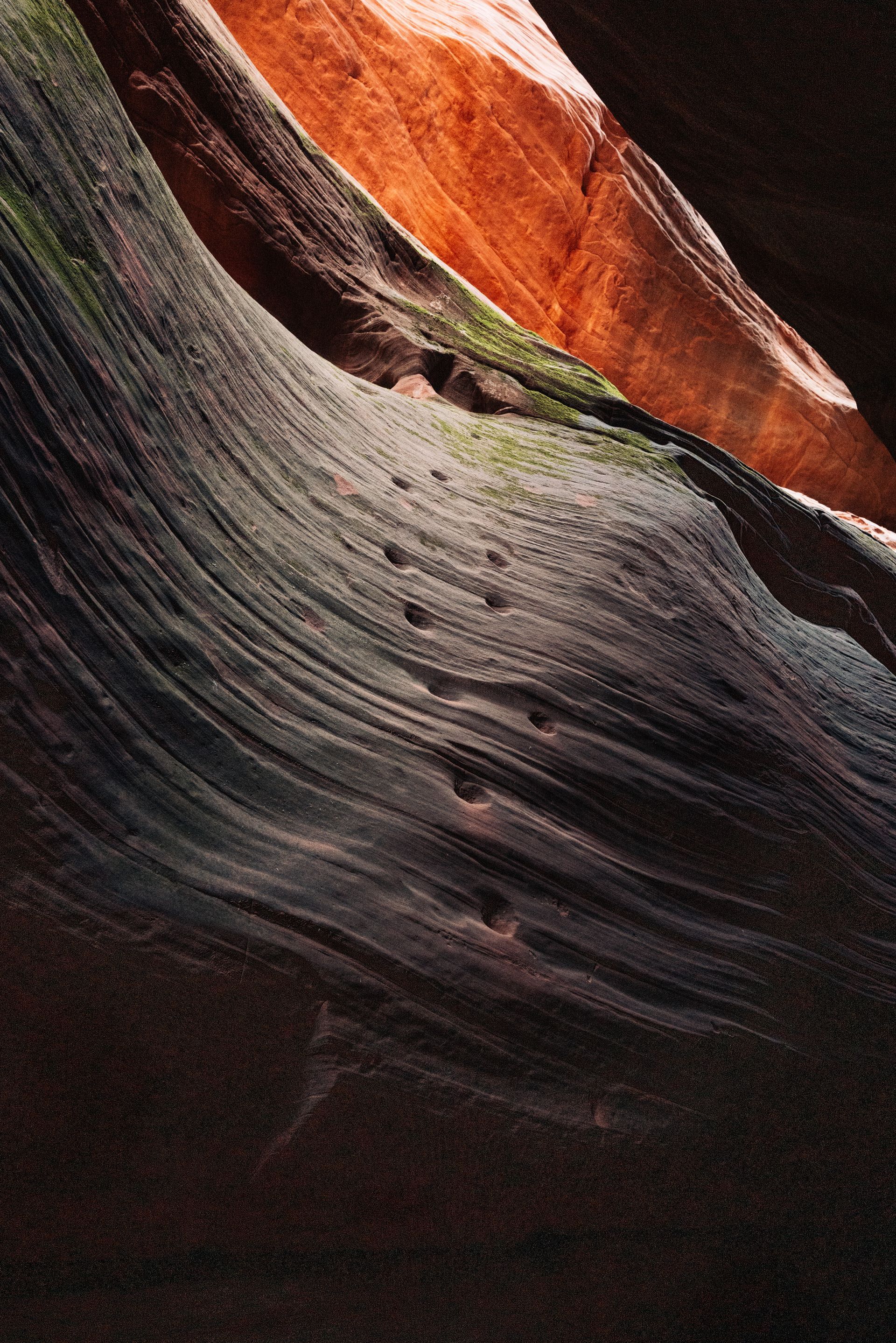 A close up of a rock formation with a dark background