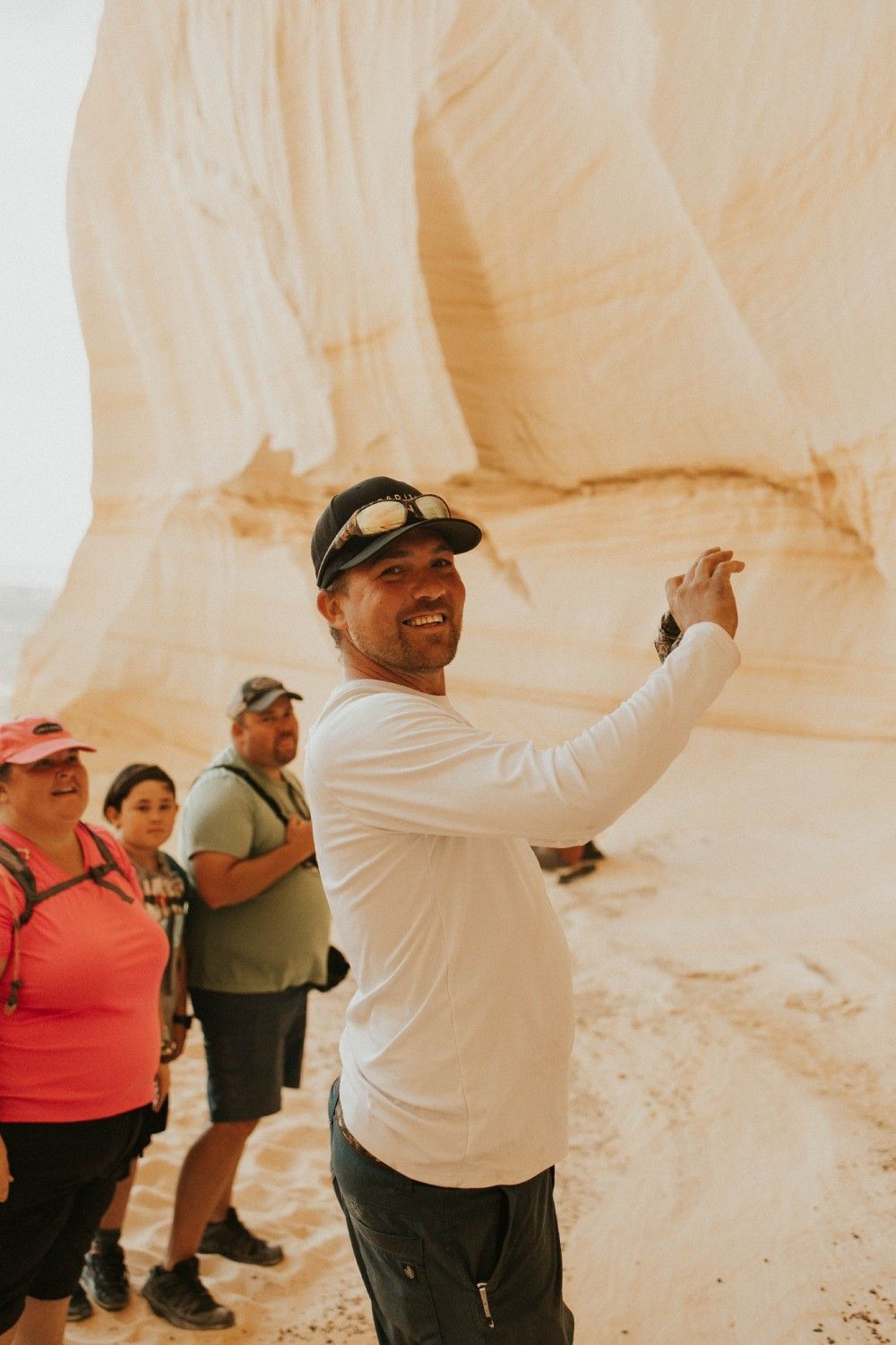 A man is taking a picture of himself in the desert.