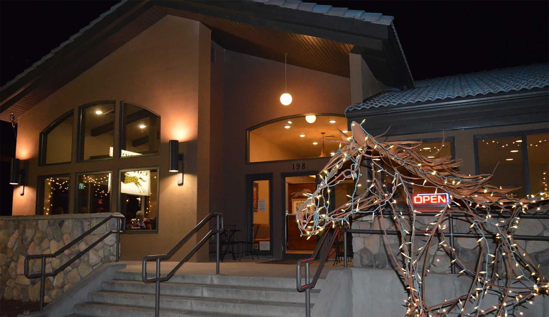 A building with a sign that says open on it