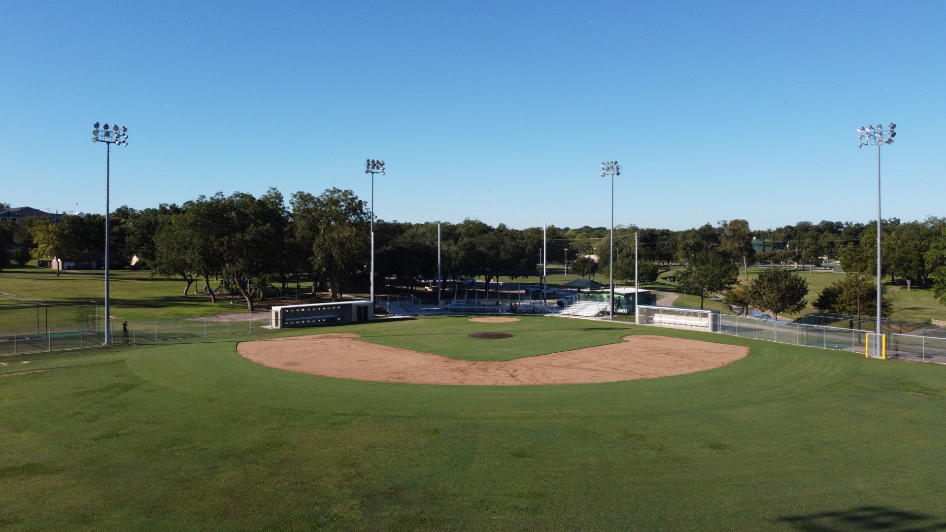 An aerial view of a baseball field in Henderson Park in Brenham, TX