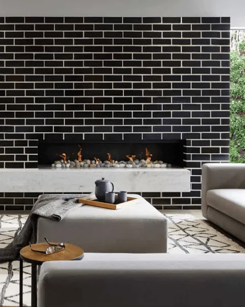 Black Brick Fireplace, White Hearth, Grey Furniture — Hunter Valley Bricks & Pavers in Scone, NSW