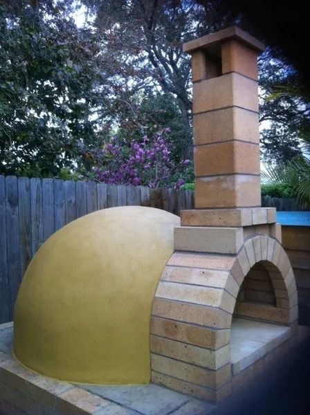 Brick Outdoor Pizza Oven With a Dome-shaped Cooking Chamber and Chimney — Hunter Valley Bricks & Pavers in Scone, NSW