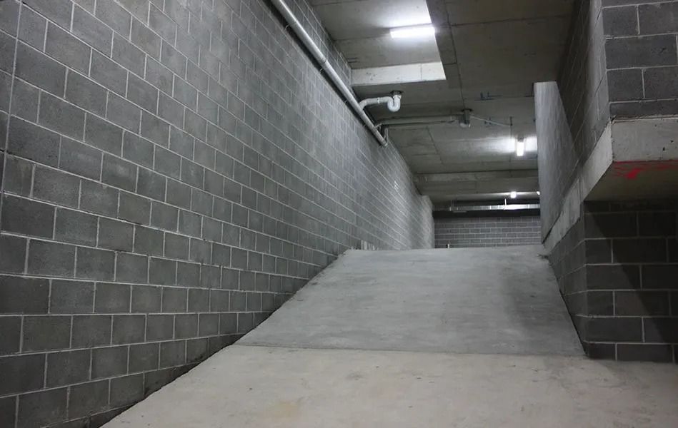 Concrete Ramp in an Unfinished Concrete Parking Garage — Hunter Valley Bricks & Pavers in Scone, NSW
