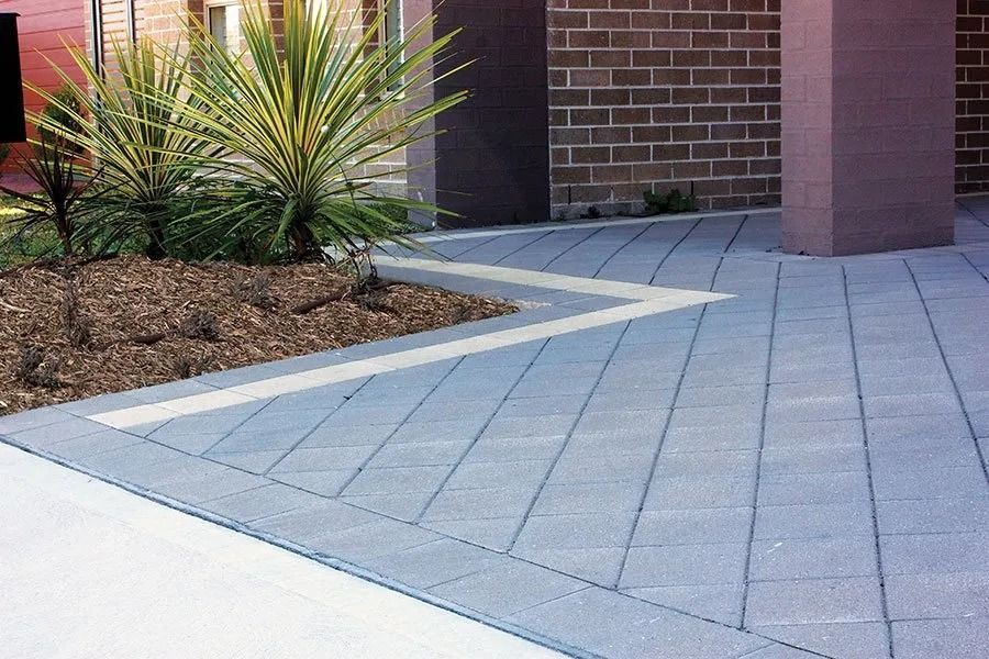 Stone Patio With Brick Building, Landscaping With Plants — Hunter Valley Bricks & Pavers in Scone, NSW
