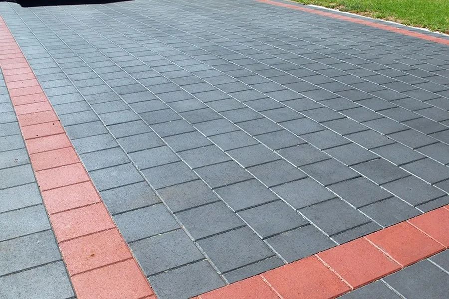 Gray Brick Pavers With a Red Border on a Driveway — Hunter Valley Bricks & Pavers in Scone, NSW