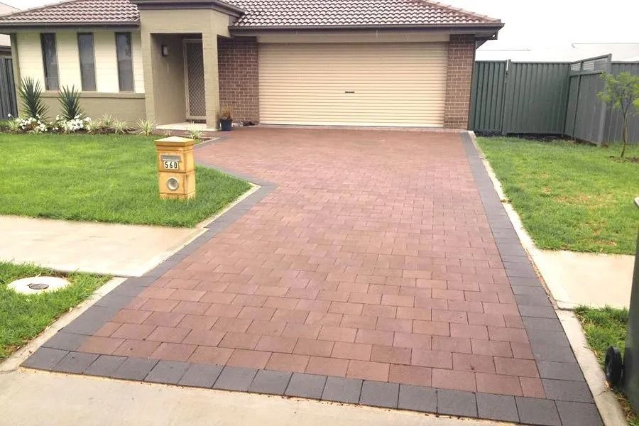 Brick Paved Driveway Leading to a House With a Garage — Hunter Valley Bricks & Pavers in Scone, NSW