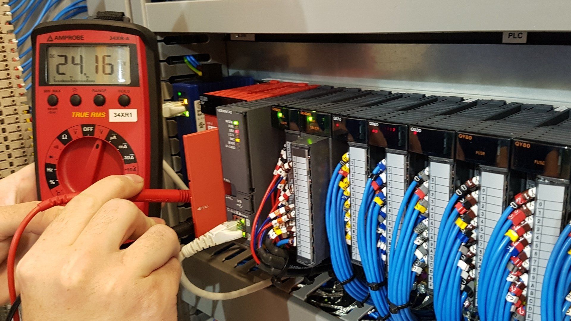 PLC testing within a control panel using a multimeter