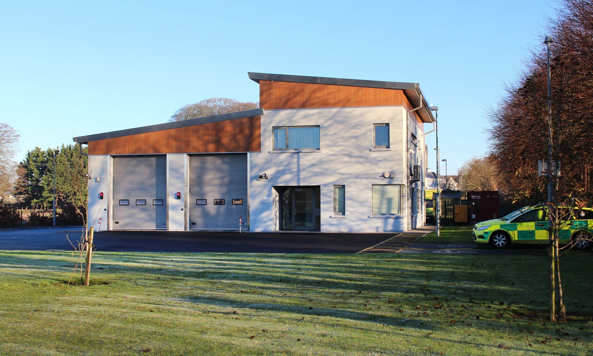 A building with a car parked in front of it