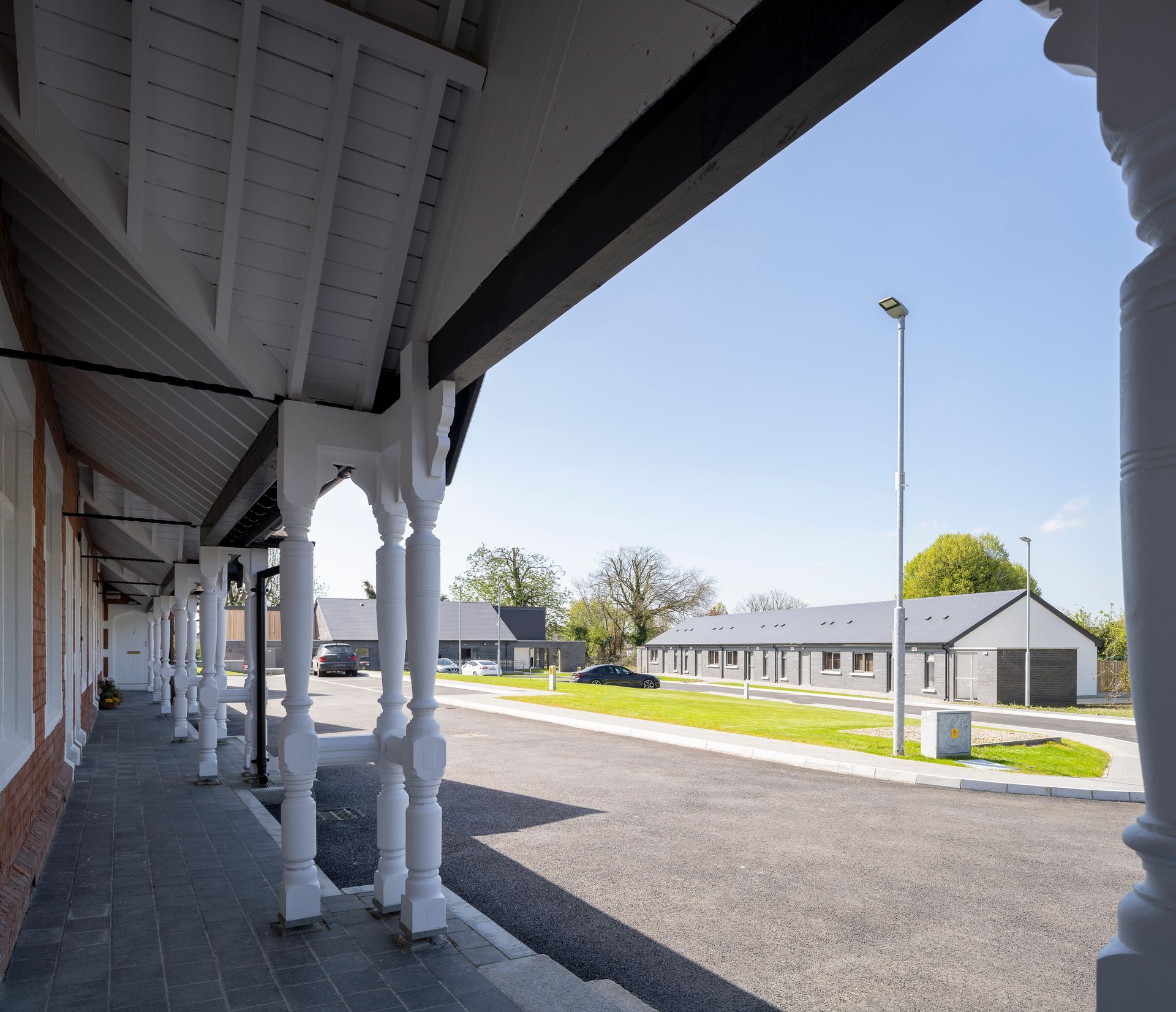 A row of white pillars along the side of a building