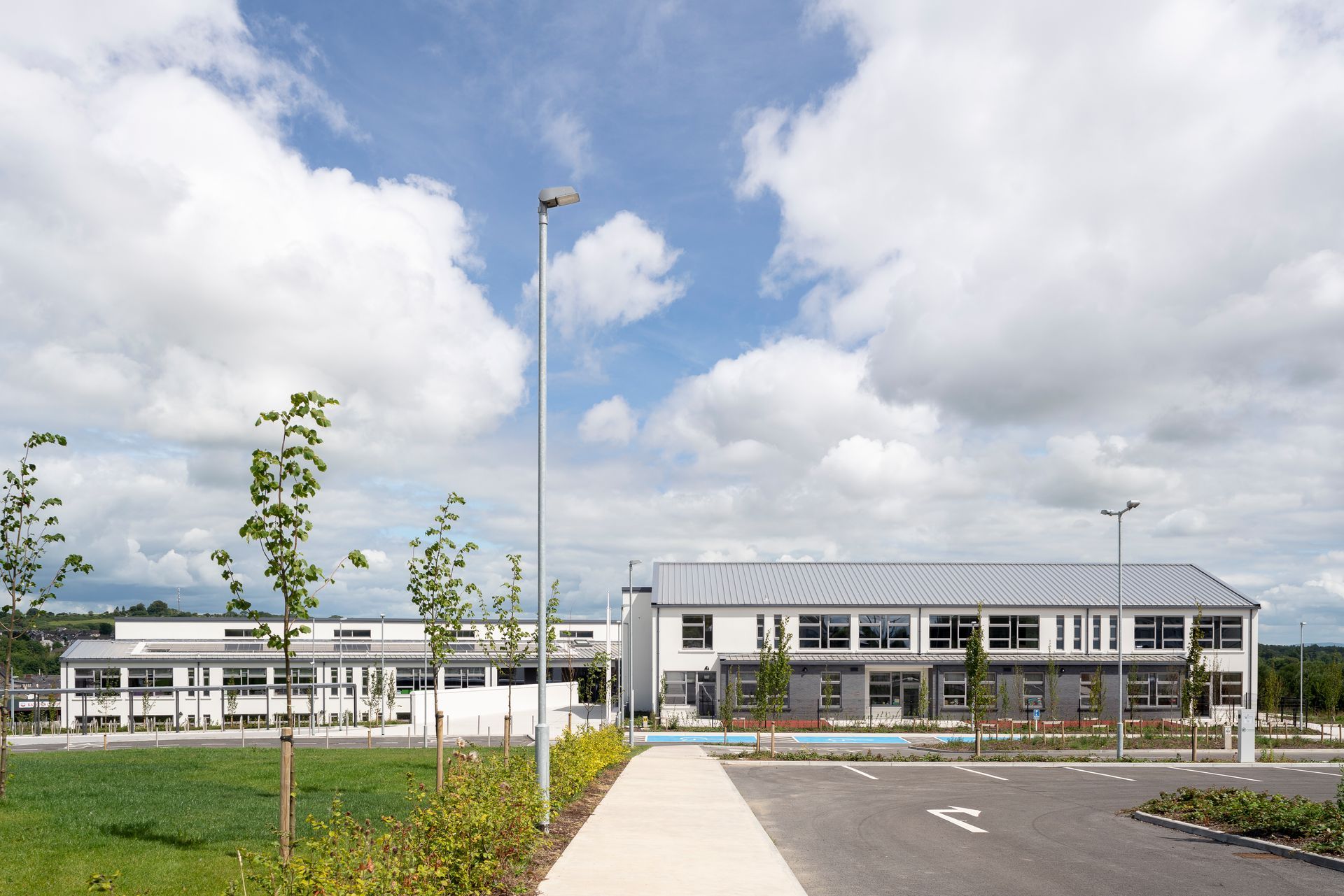 A large building with a parking lot in front of it