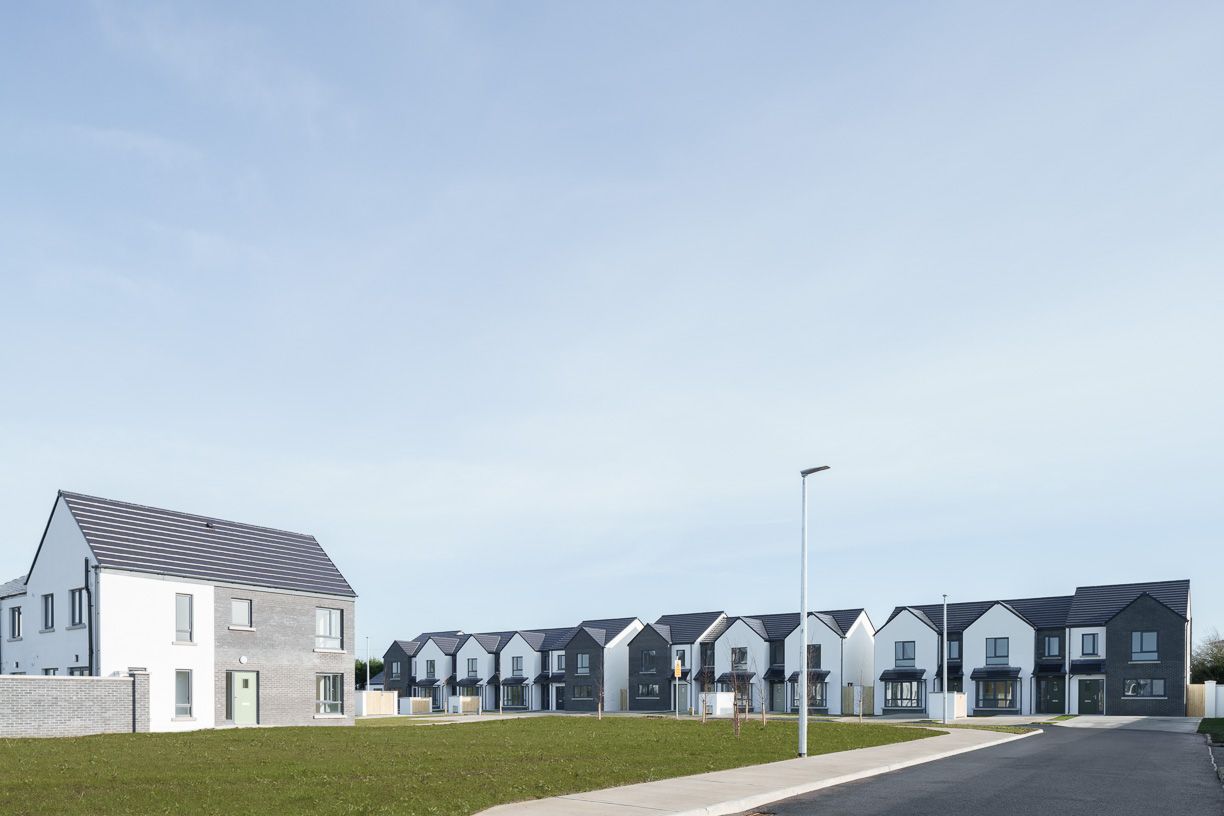 An artist 's impression of a row of houses in a residential area.