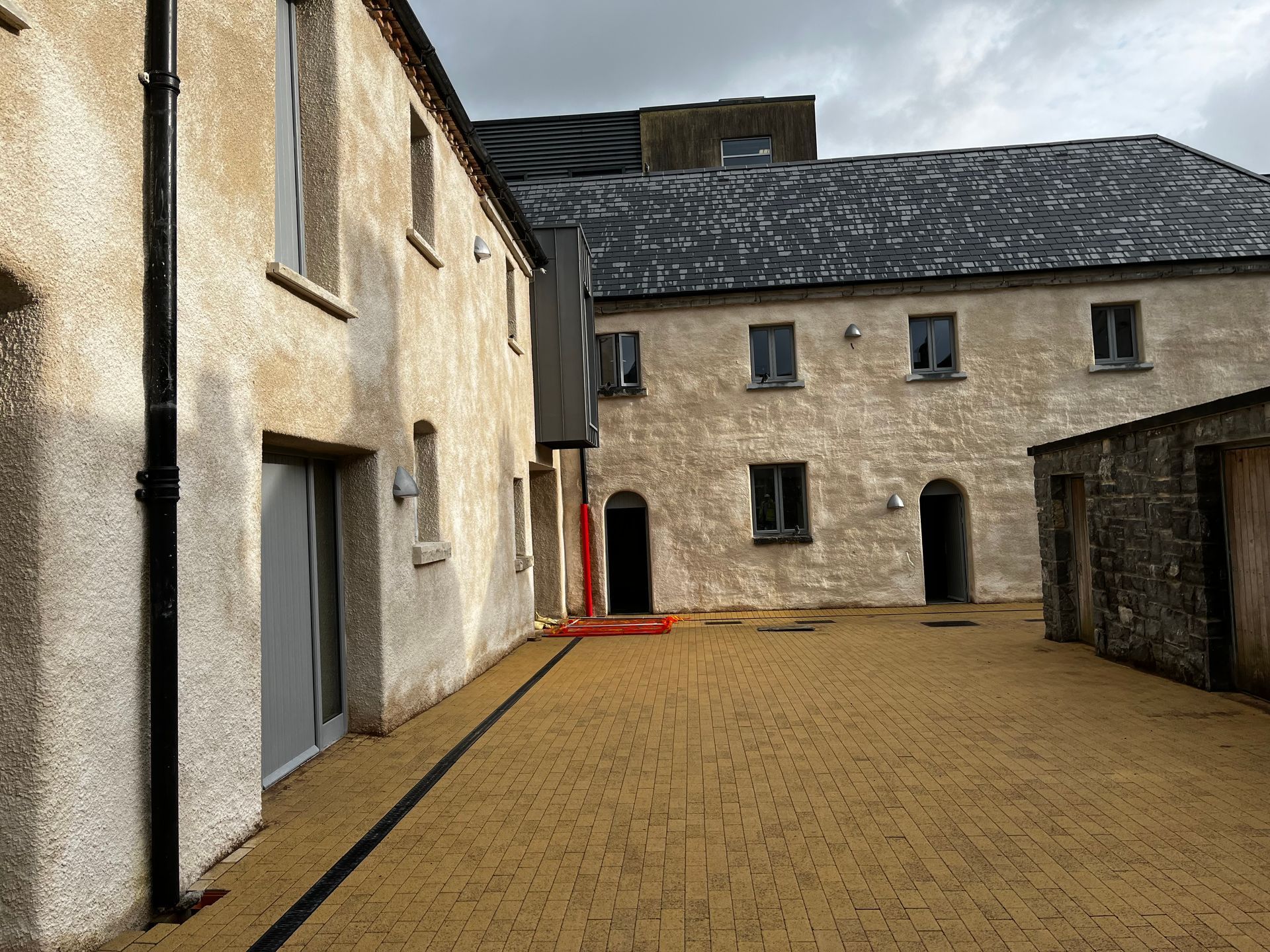 A large building with a lot of windows and doors