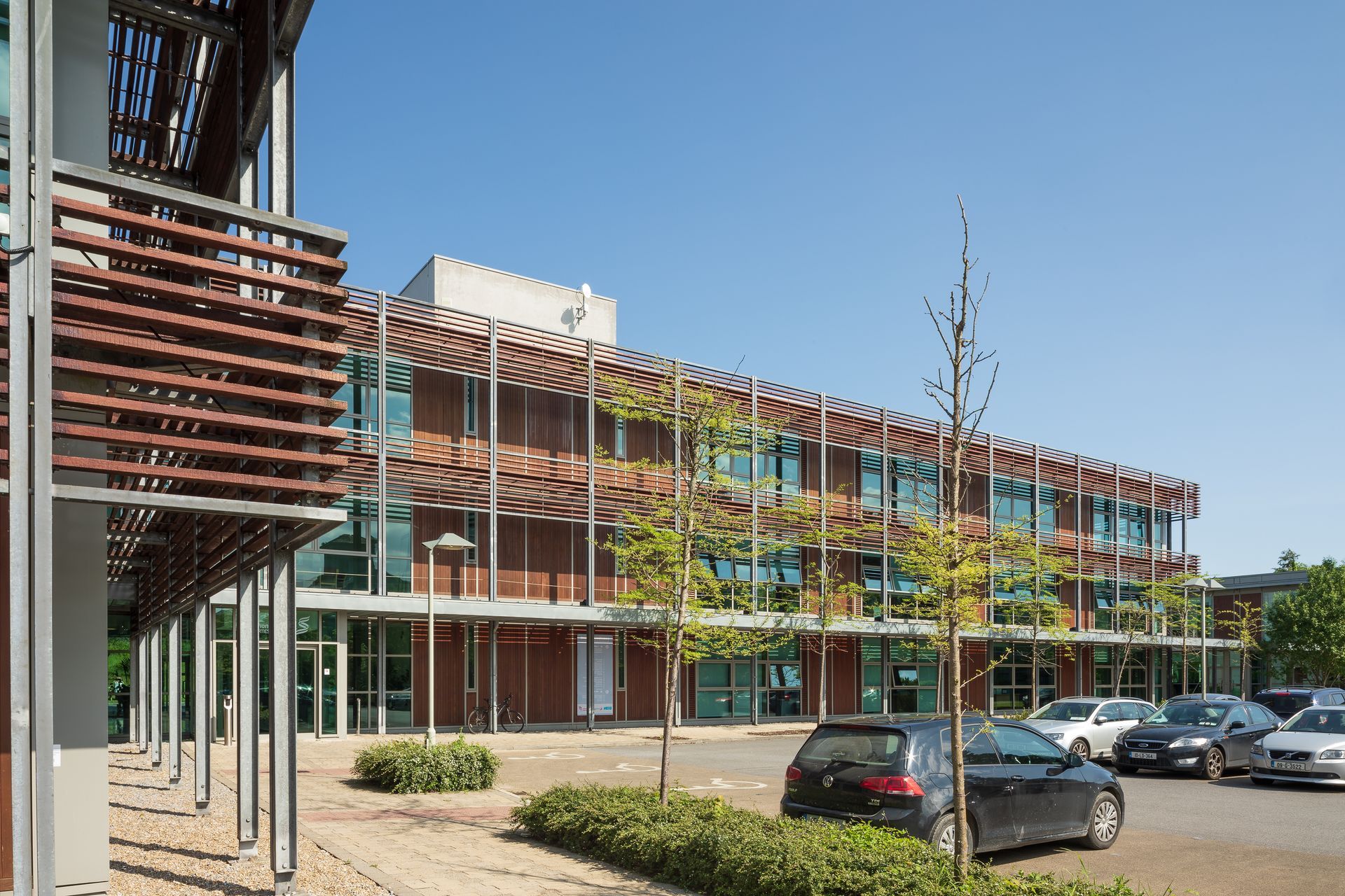 A large building with cars parked in front of it