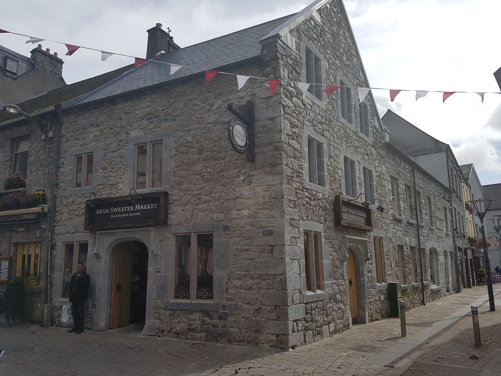 A large stone building with a clock on the side of it