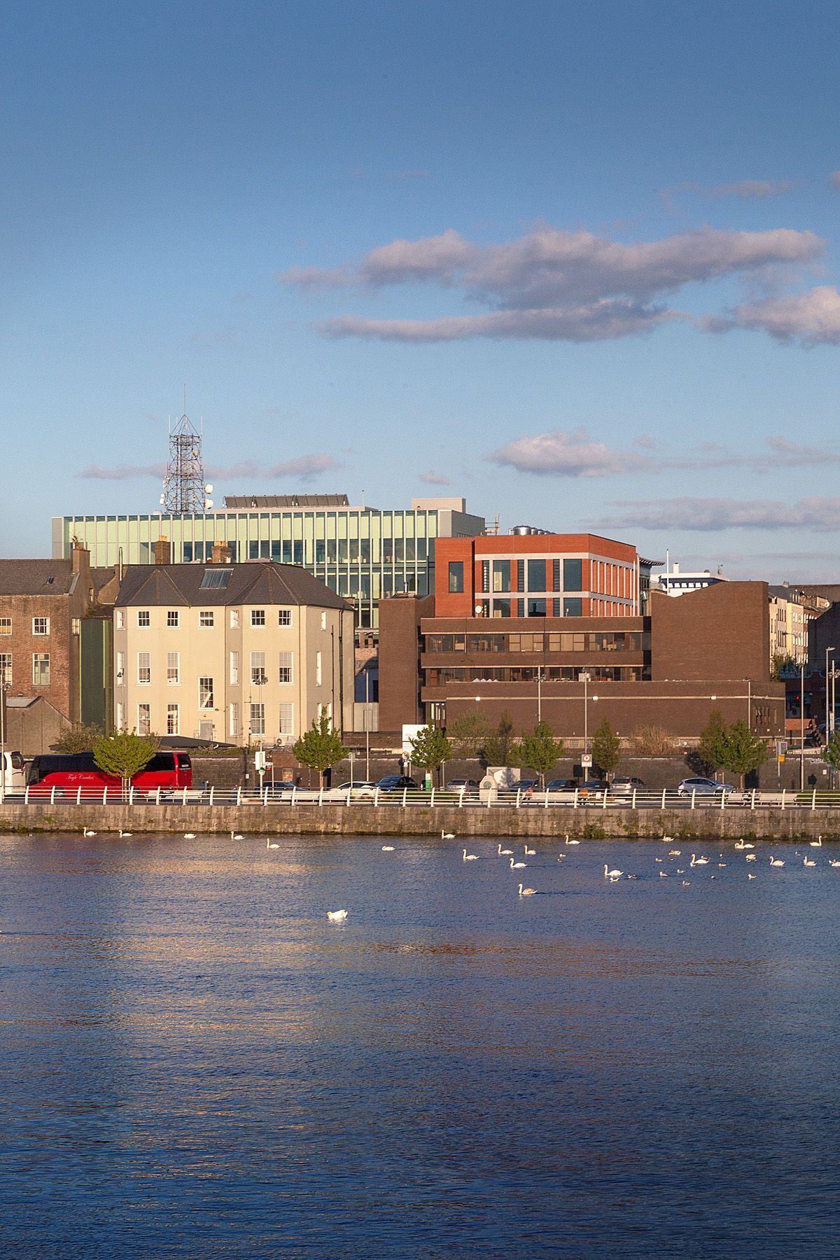 A large body of water with buildings in the background
