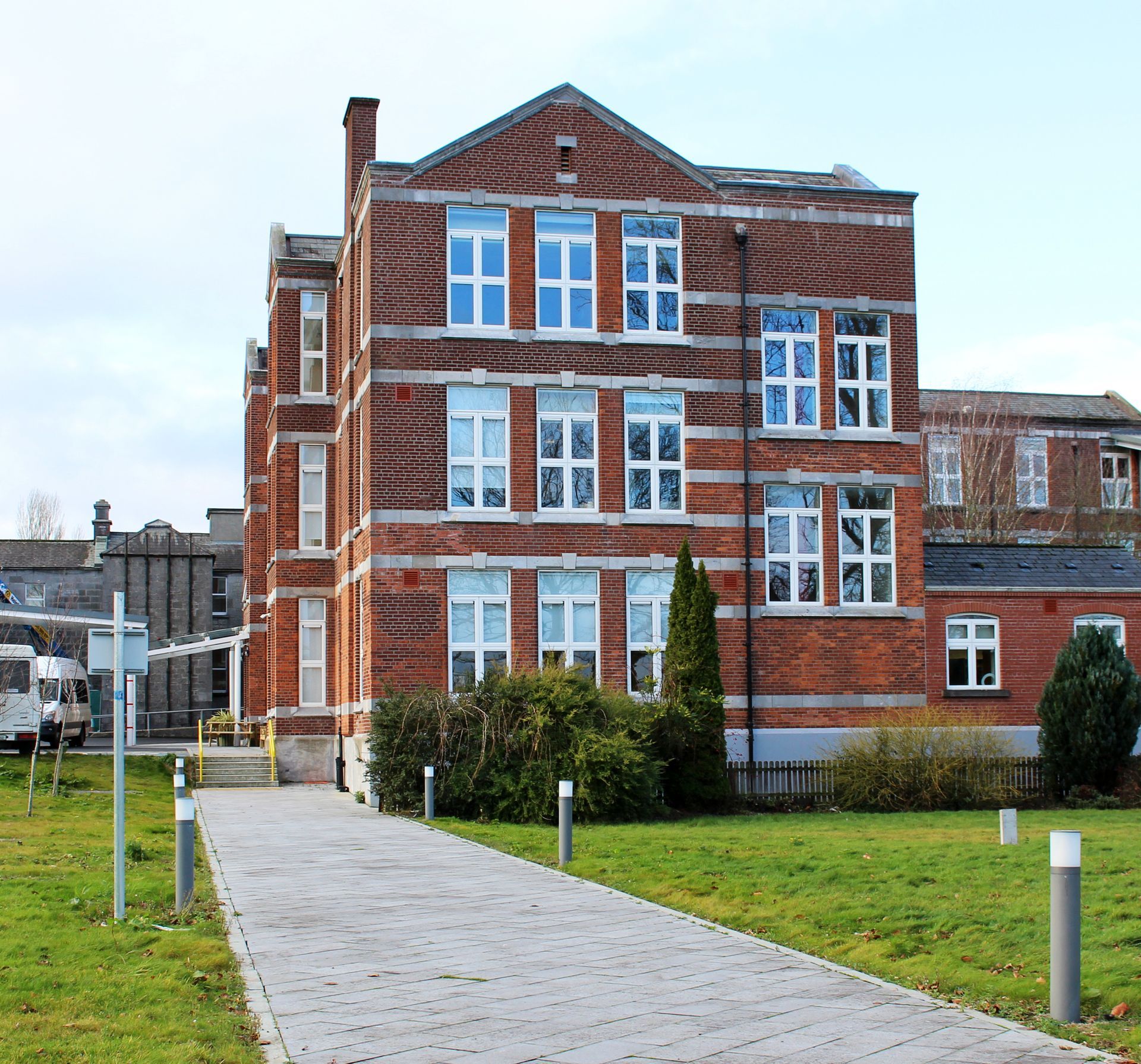 A large brick building with a lot of windows