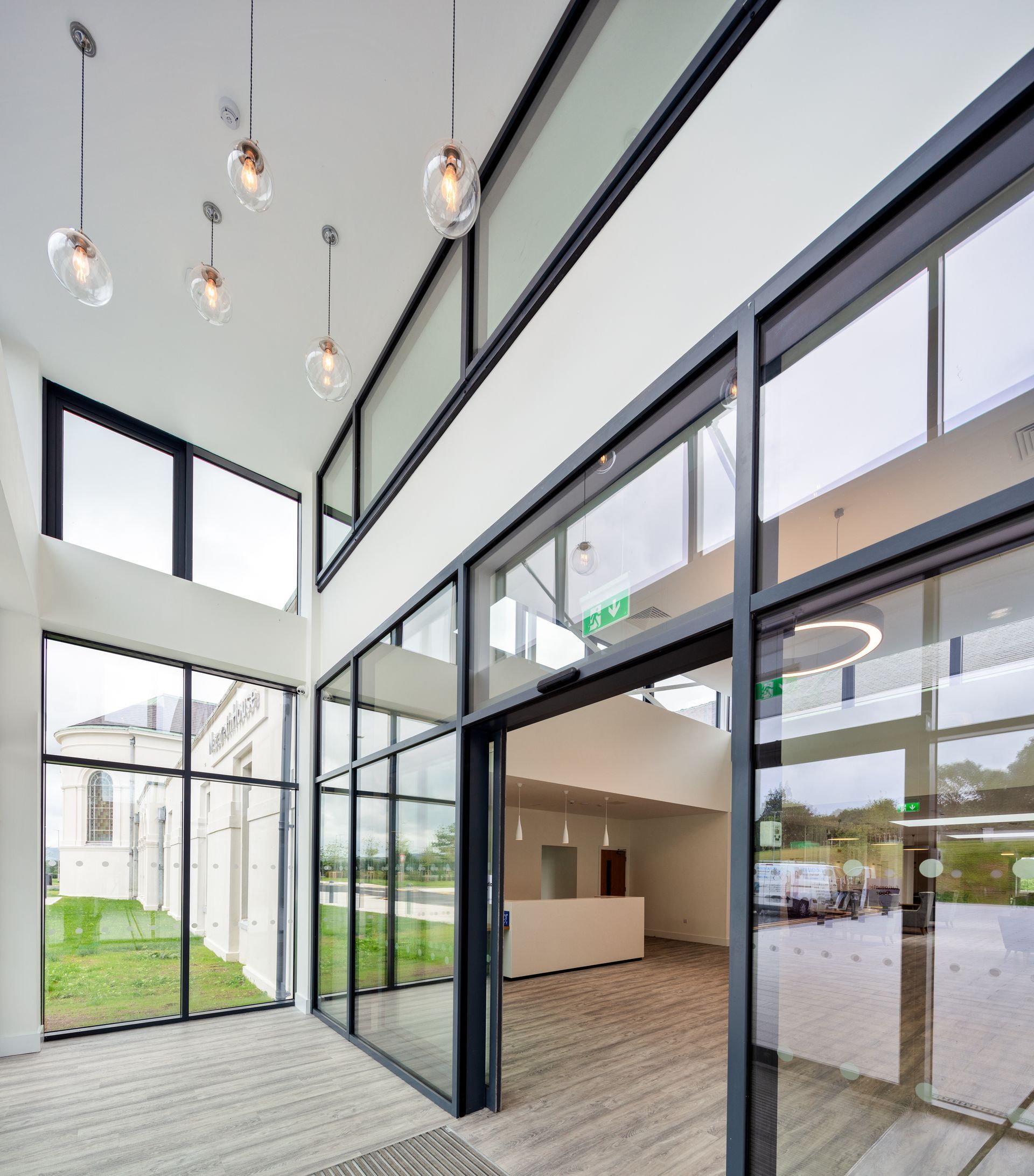 A large room with lots of windows and a sliding glass door