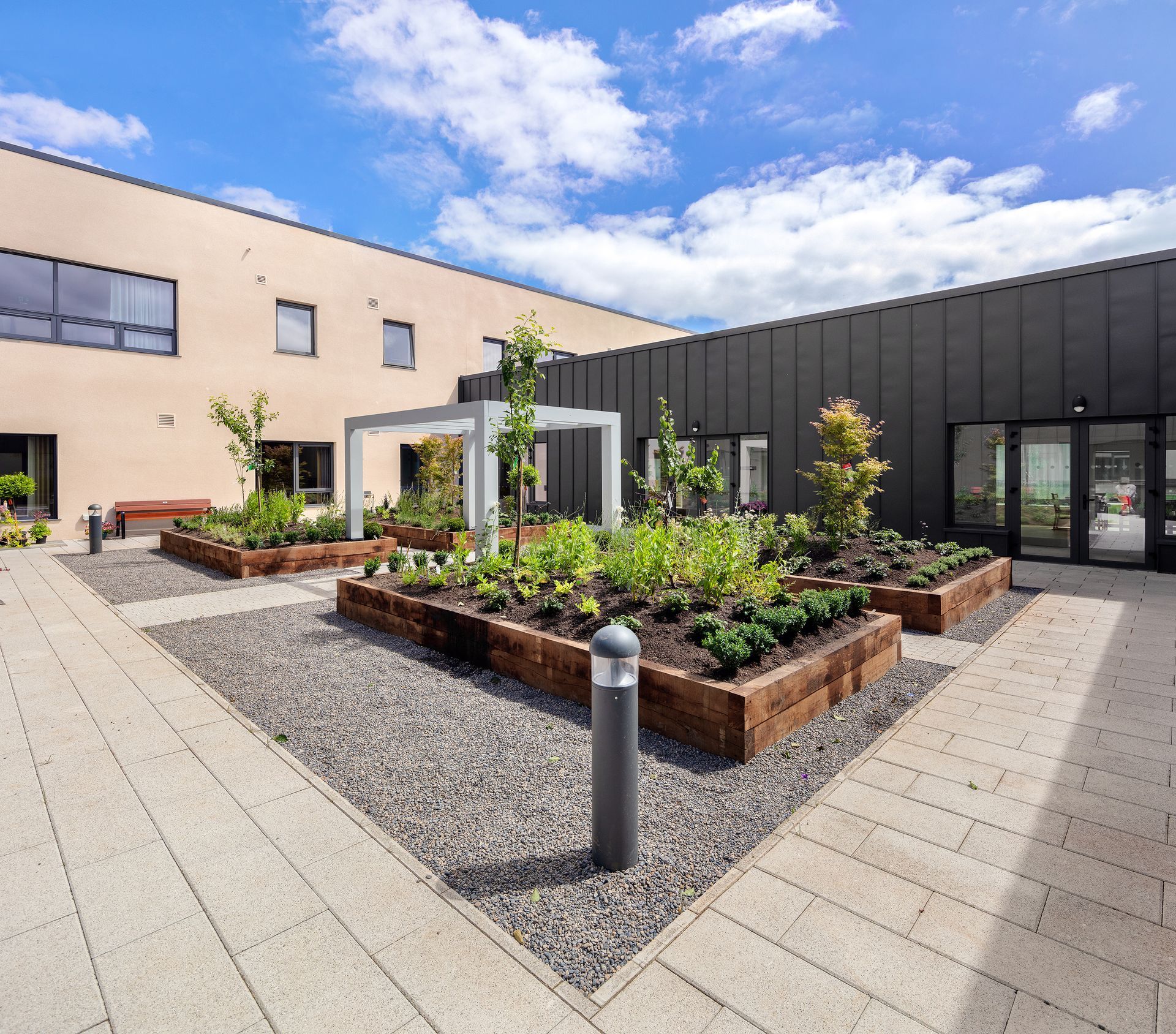 A large building with a garden in front of it