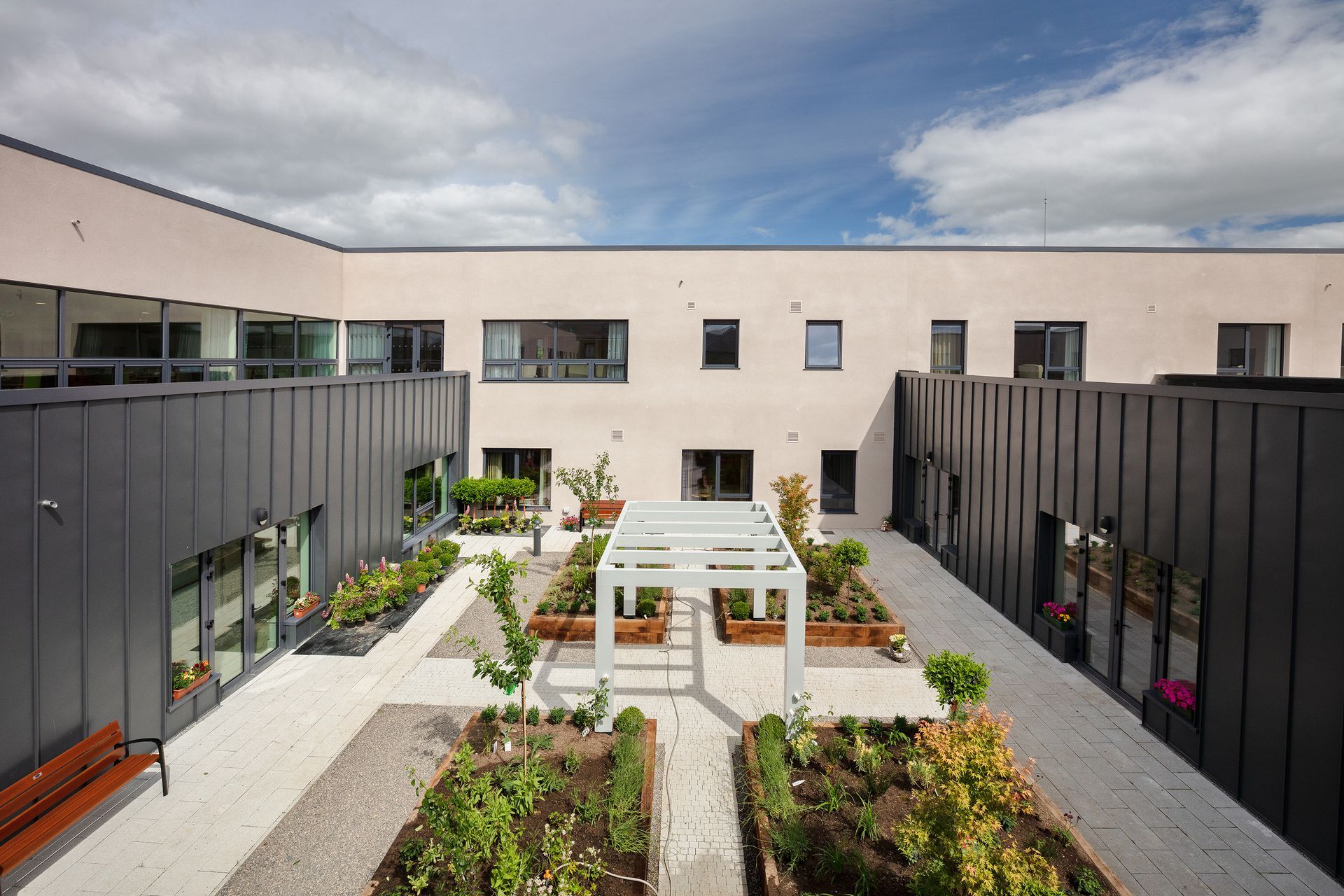 A large building with a garden in front of it